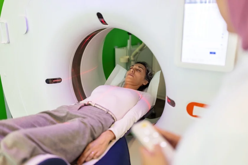 Woman undergoing MRI scan